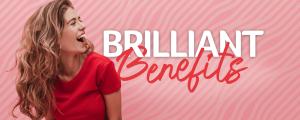 Female presenting person in a red shirt laughing next to the words Brilliant Benefits.
